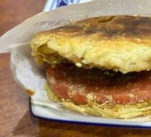 Pork-filled flatbread sandwich