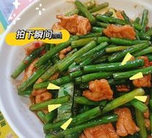 Stir-fried garlic shoots with pork