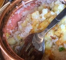 Raw Rice Stewed in Copper Pot with Potatoes