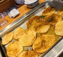 Grilled Potato Slices on Iron Plate