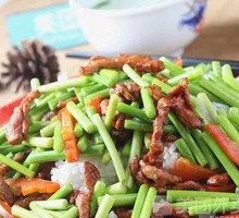 Stir-fried Garlic Shoots with Pork over Rice