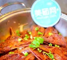 Spicy Duck Heads on Iron Plate