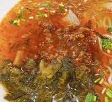 Spicy Sichuan Beef Noodles with Pickled Cabbage