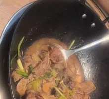 Flame-Infused Duck in Wine Sauce