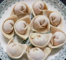 Shiitake Pork Dumplings with Peanut Sauce
