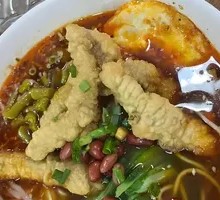 Sour and Spicy Rice Noodles with Crispy Pork