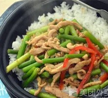 Stir-fried garlic shoots with pork over rice