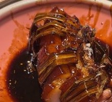 Black Pork Wrapped in Green Rice Straw