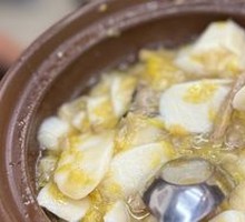 Stewed Yellow Mustard Greens with Pork Shreds and Rice Noodles in a Pot