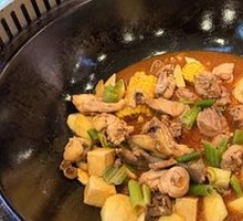 Stewed Rooster in Iron Pot