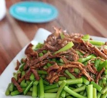 Stir-fried garlic shoots with pork over rice