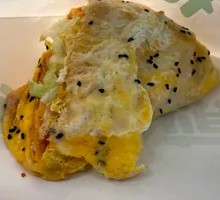 Double Egg Bacon and Sesame Seed Pancake