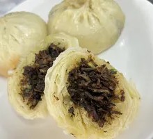 Braised Mustard Greens and Minced Pork Dumplings