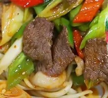 Onion Stir-Fry with Pork over Noodles