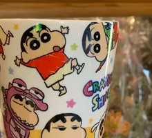 The TV is showing Crayon Shin-chan