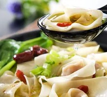 Pork Dumplings with Red Oil Sauce