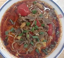 Tofu and Chicken Offal Noodles with Pickled Peppers