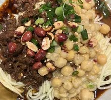 Signature Spicy Noodles with Peas and Pork